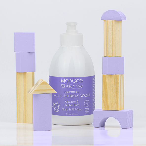 MooGoo natural 2 in 1 bubbly wash in white background, surrounded by children's building blocks. 