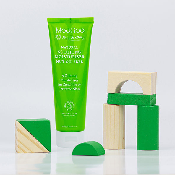 MooGoo Soothing Moisturiser Nut Oil Free with wooden blocks, protective nut-free cream offering soft hydration for fragile sensitive skin