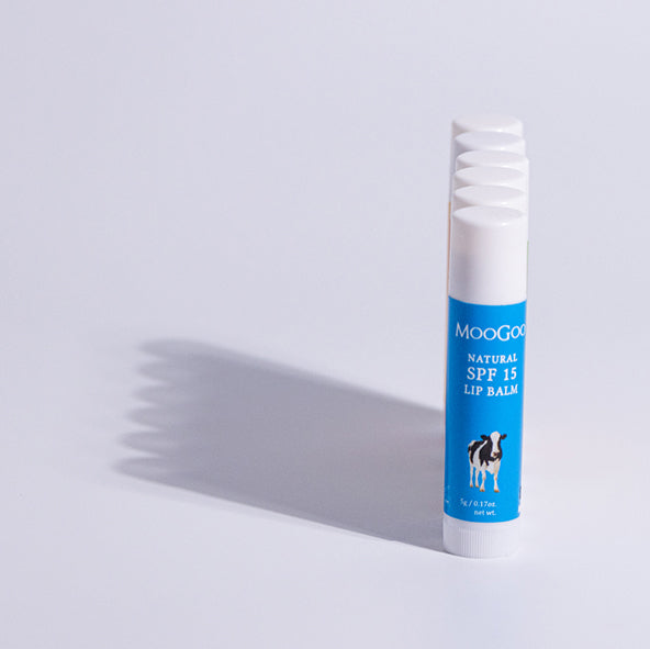 Straight line of MooGoo Natural SPF 15 Lip Balm, hydrating sun protective lip care with zinc oxide for smooth, moisturised lips.